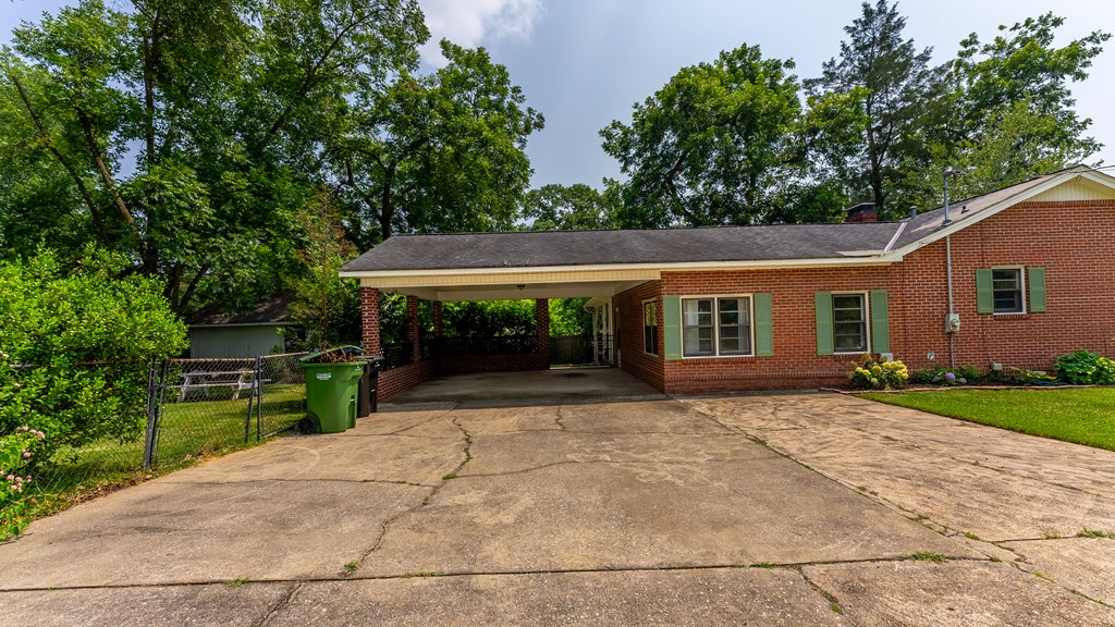 5352 Moon Road Columbus, GA 31909 - Photo 3 of 50 front view of house with a yard and potted plants