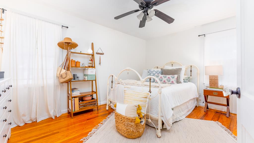 5352 Moon Road Columbus, GA 31909 - Photo 32 of 50 a bed room with a bed and a chandelier