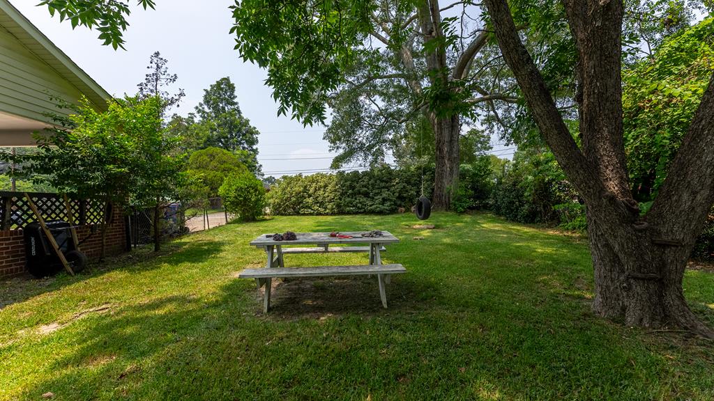 5352 Moon Road Columbus, GA 31909 - Photo 43 of 50 a view of a backyard with a bench