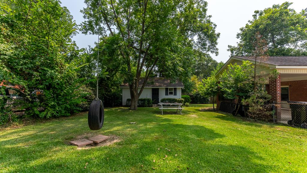 5352 Moon Road Columbus, GA 31909 - Photo 45 of 50 a backyard of a house with table and chairs
