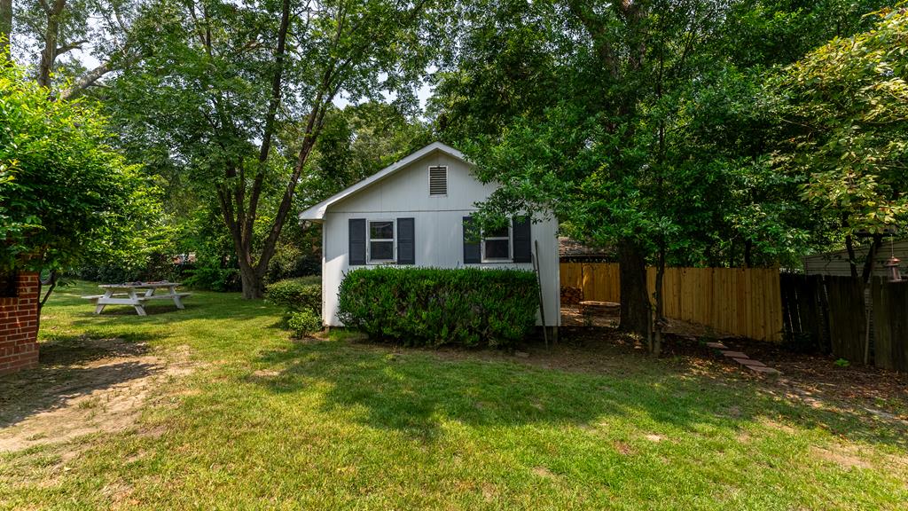 5352 Moon Road Columbus, GA 31909 - Photo 48 of 50 a view of a house with a yard and sitting area
