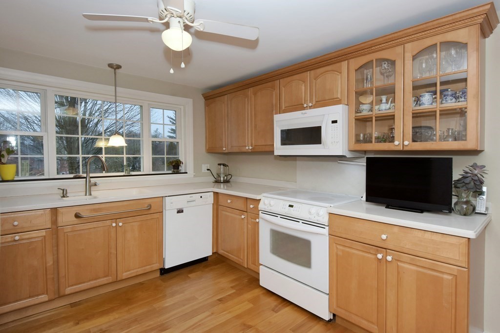 45 McGregory Road Sturbridge, MA 01566 - Photo 16 of 36 a kitchen with stainless steel appliances white cabinets granite counter tops and a window