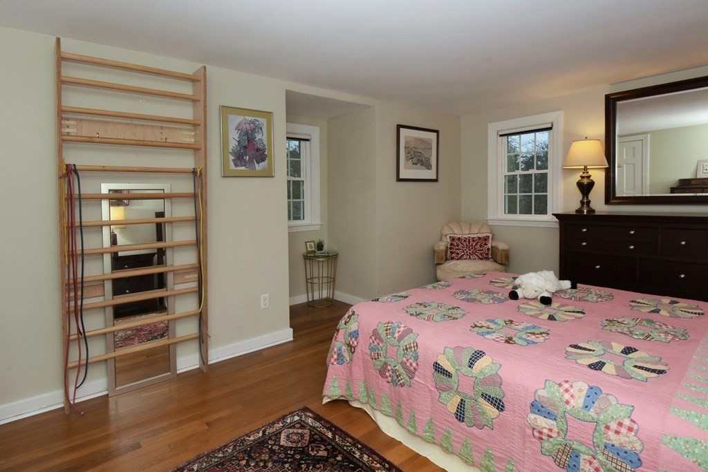45 McGregory Road Sturbridge, MA 01566 - Photo 30 of 36 a bedroom with a bed and a dresser