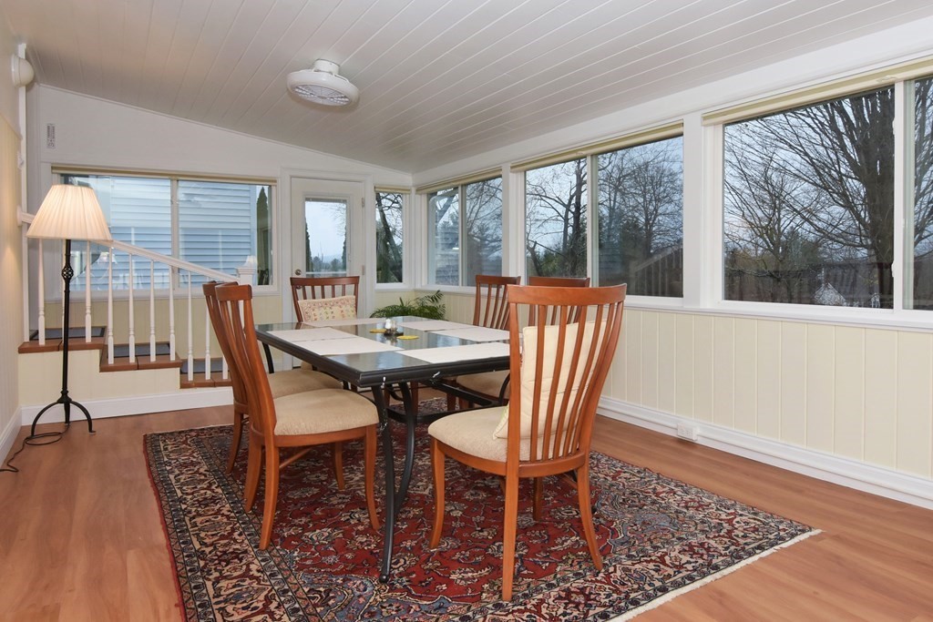 45 McGregory Road Sturbridge, MA 01566 - Photo 9 of 36 a dining room with furniture wooden floor and a rug