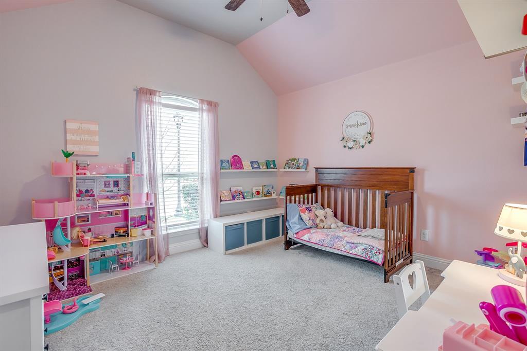 15141 Fleet Hill Road Aledo, TX 76008 - Photo 18 of 37 Adorable bedroom 2 with carpet, ceiling fan and wonderful closet.