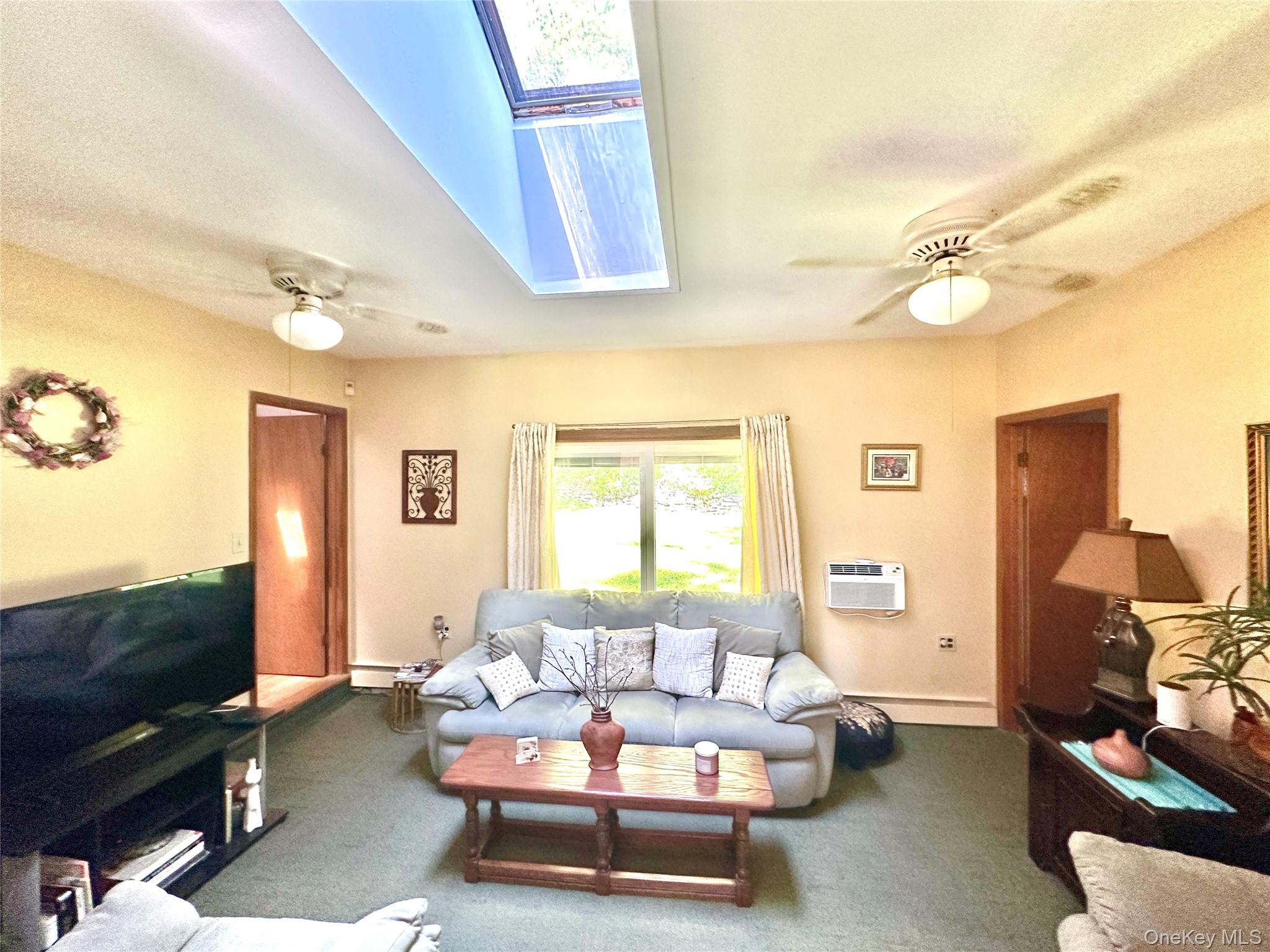 12 Mesmer Hill Road Callicoon, NY 12723 - Photo 10 of 18 a living room with furniture and a flat screen tv