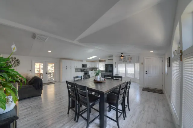 a kitchen with a table and chairs in it