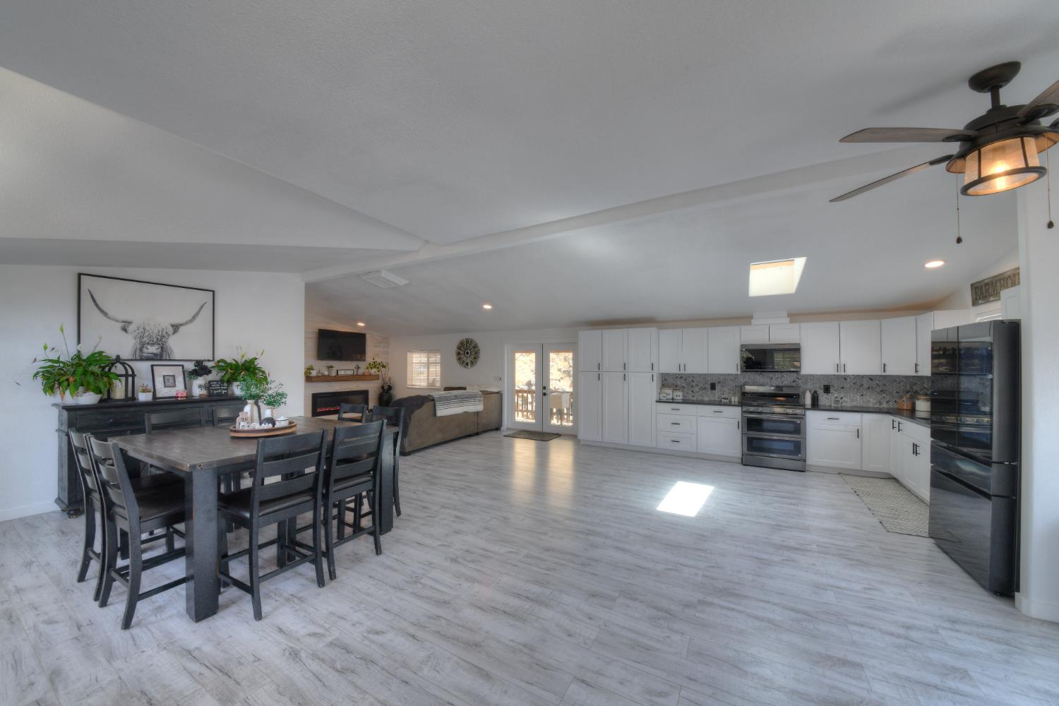 17045 Table Mountain Road Jamestown, CA 95327 - Photo 16 of 59 a view of a dining area with furniture and wooden floor