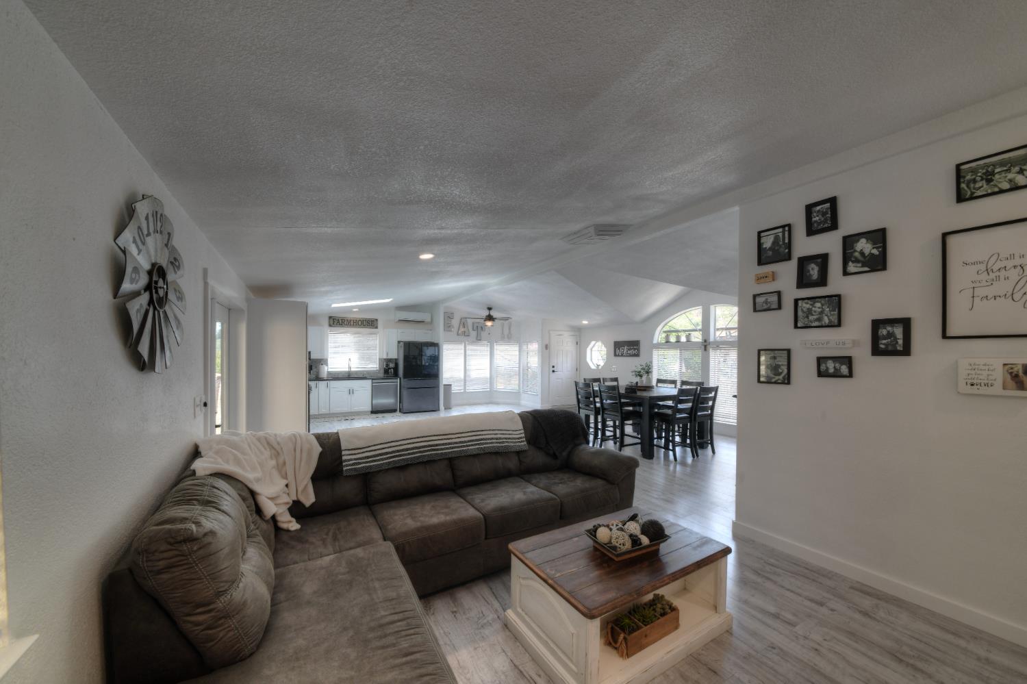 17045 Table Mountain Road Jamestown, CA 95327 - Photo 17 of 59 a living room with furniture and a wooden floor