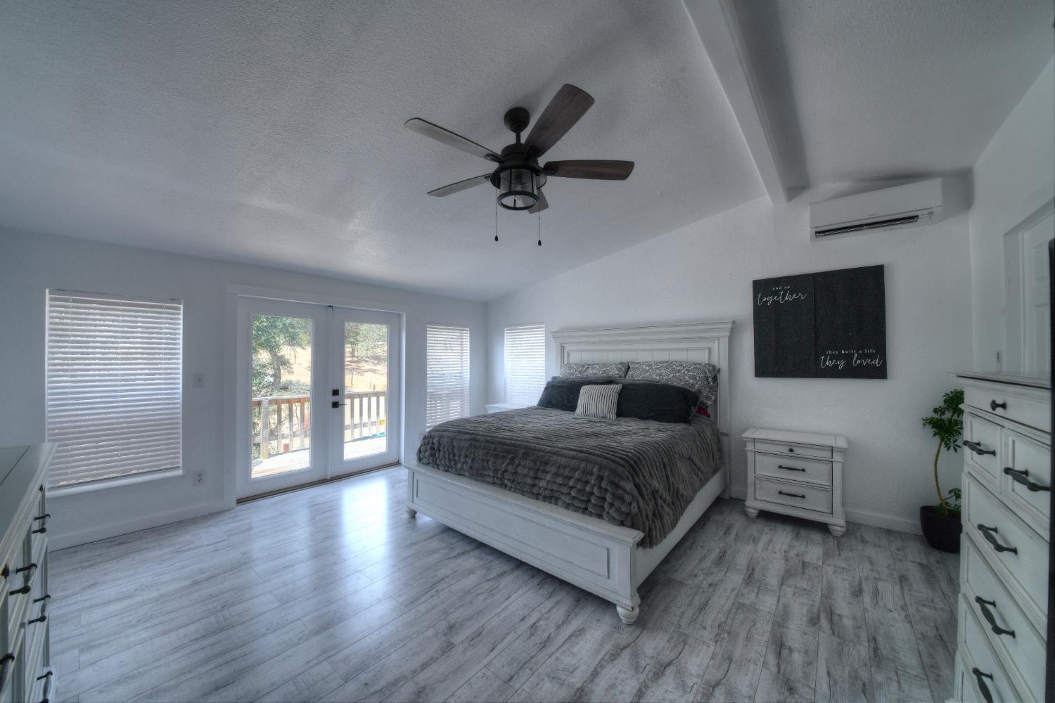 17045 Table Mountain Road Jamestown, CA 95327 - Photo 24 of 59 a living room with a bed furniture and a flat screen tv