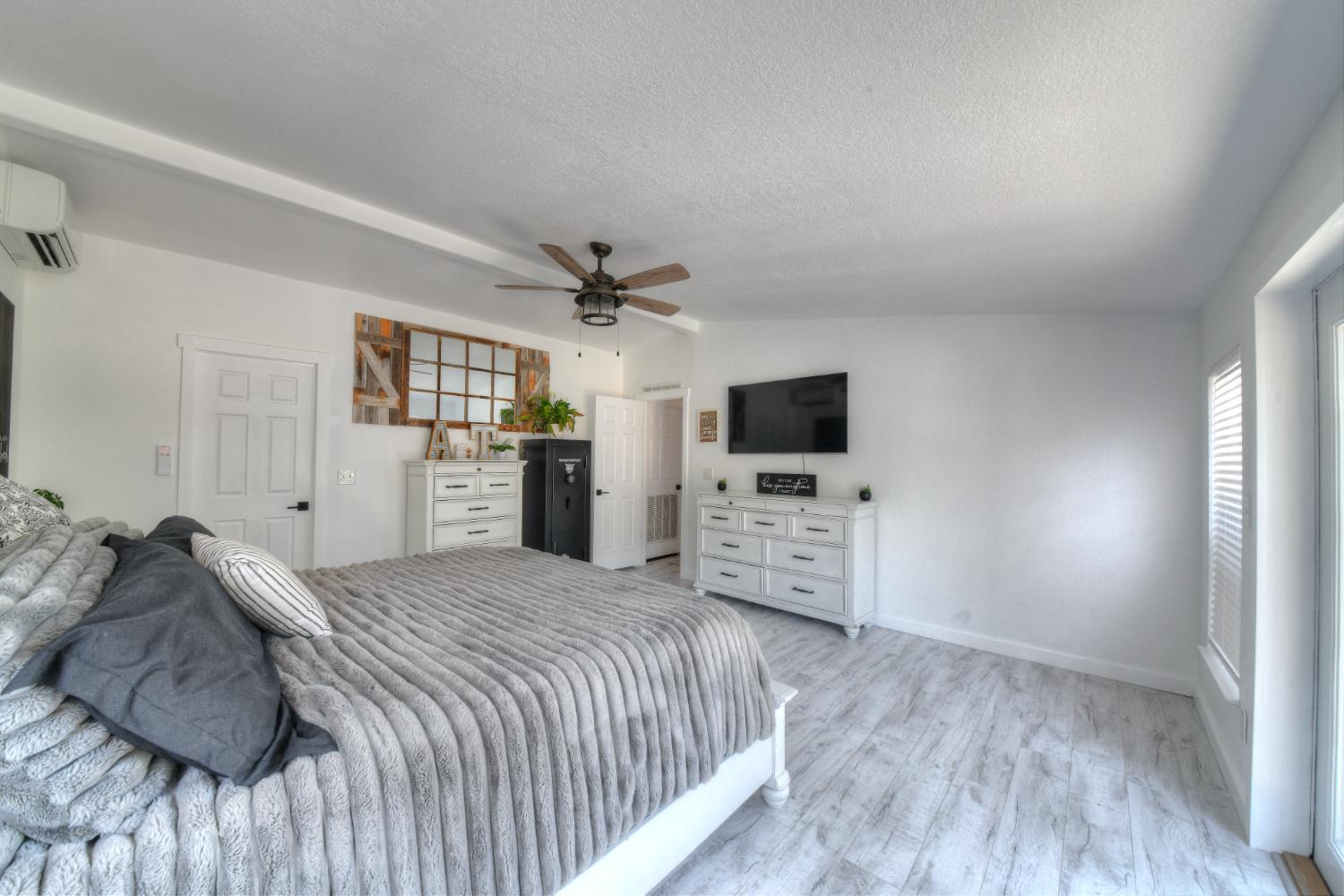 17045 Table Mountain Road Jamestown, CA 95327 - Photo 25 of 59 a bedroom with a bed and a flat screen tv