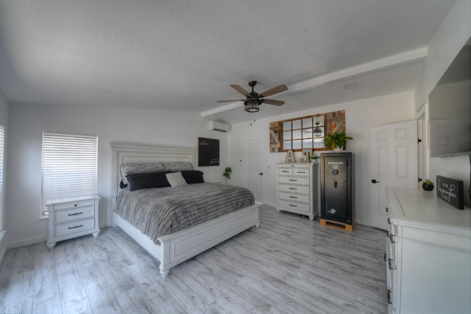17045 Table Mountain Road Jamestown, CA 95327 - Photo 26 of 59 a bedroom with a bed and a flat tv screen on dresser