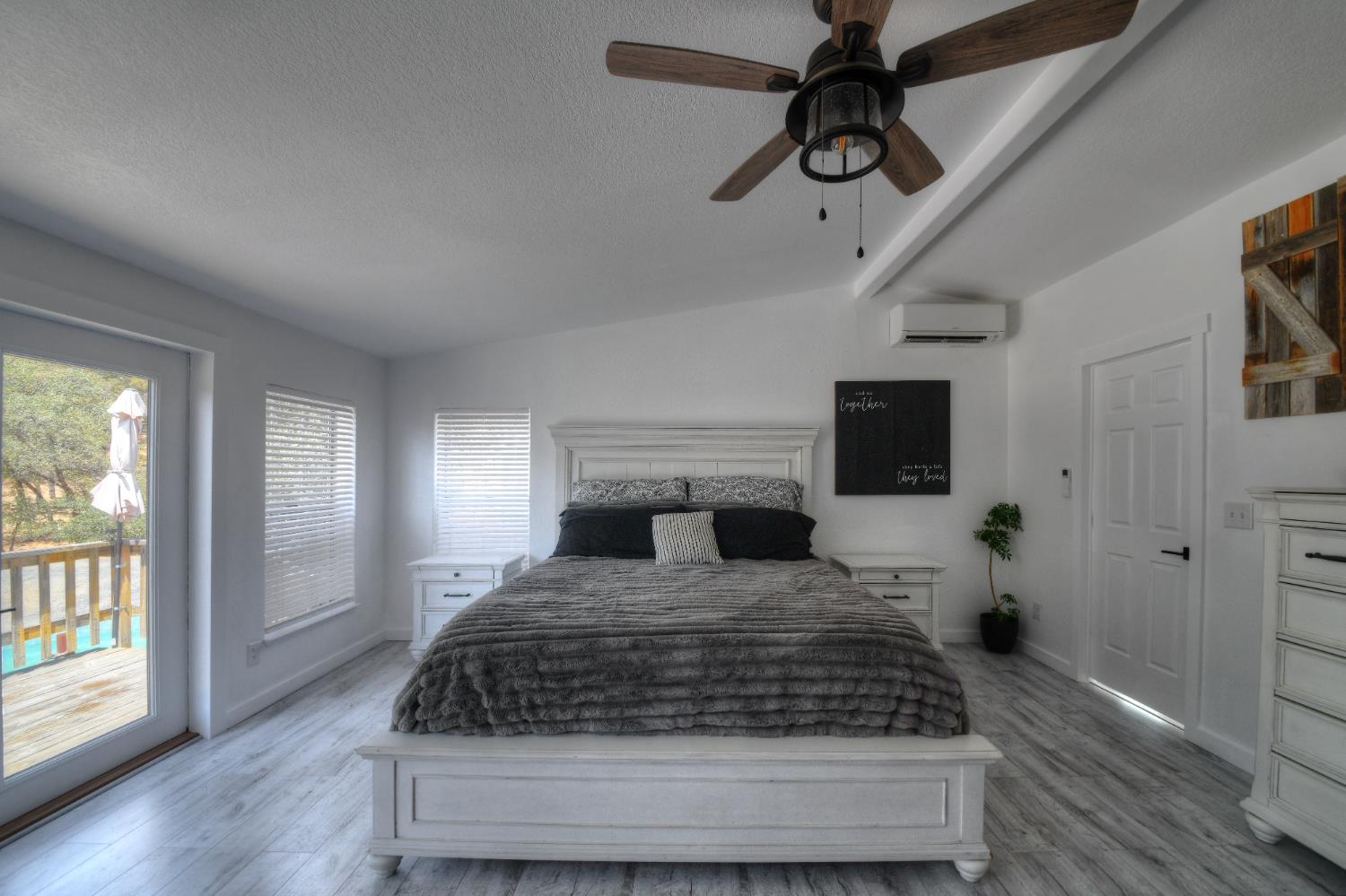 17045 Table Mountain Road Jamestown, CA 95327 - Photo 27 of 59 a bedroom with a large bed and a window