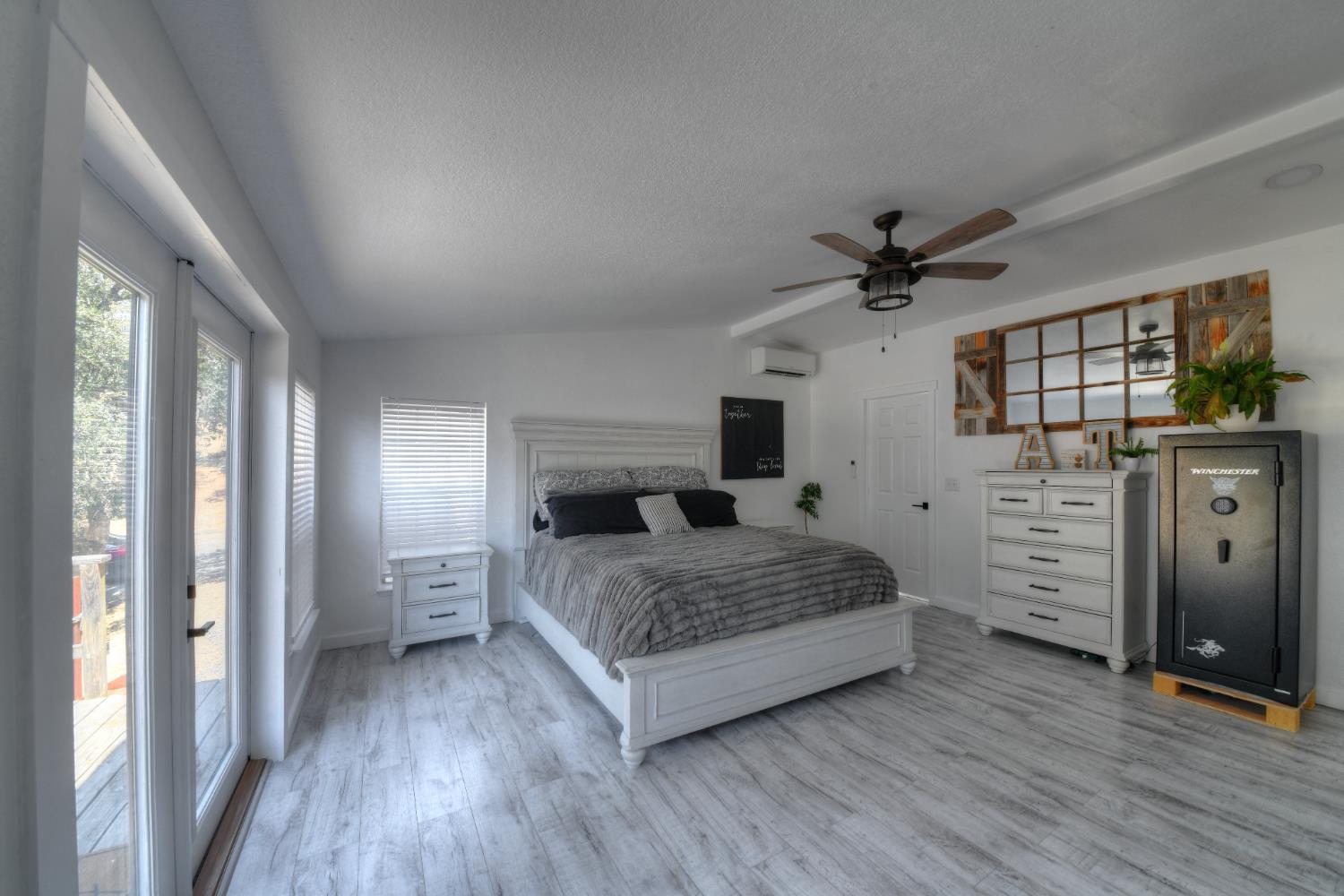 17045 Table Mountain Road Jamestown, CA 95327 - Photo 28 of 59 a bedroom with a bed and a flat tv screen