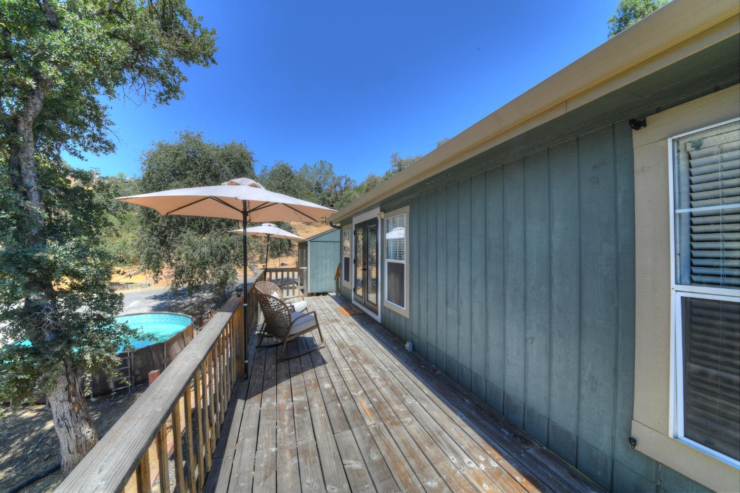 17045 Table Mountain Road Jamestown, CA 95327 - Photo 37 of 59 a view of balcony with wooden floor and barbeque oven