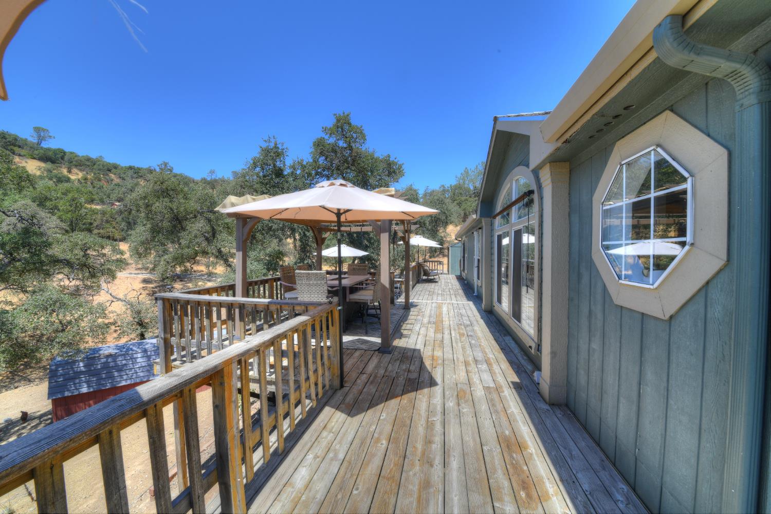 17045 Table Mountain Road Jamestown, CA 95327 - Photo 40 of 59 a view of a house with wooden deck
