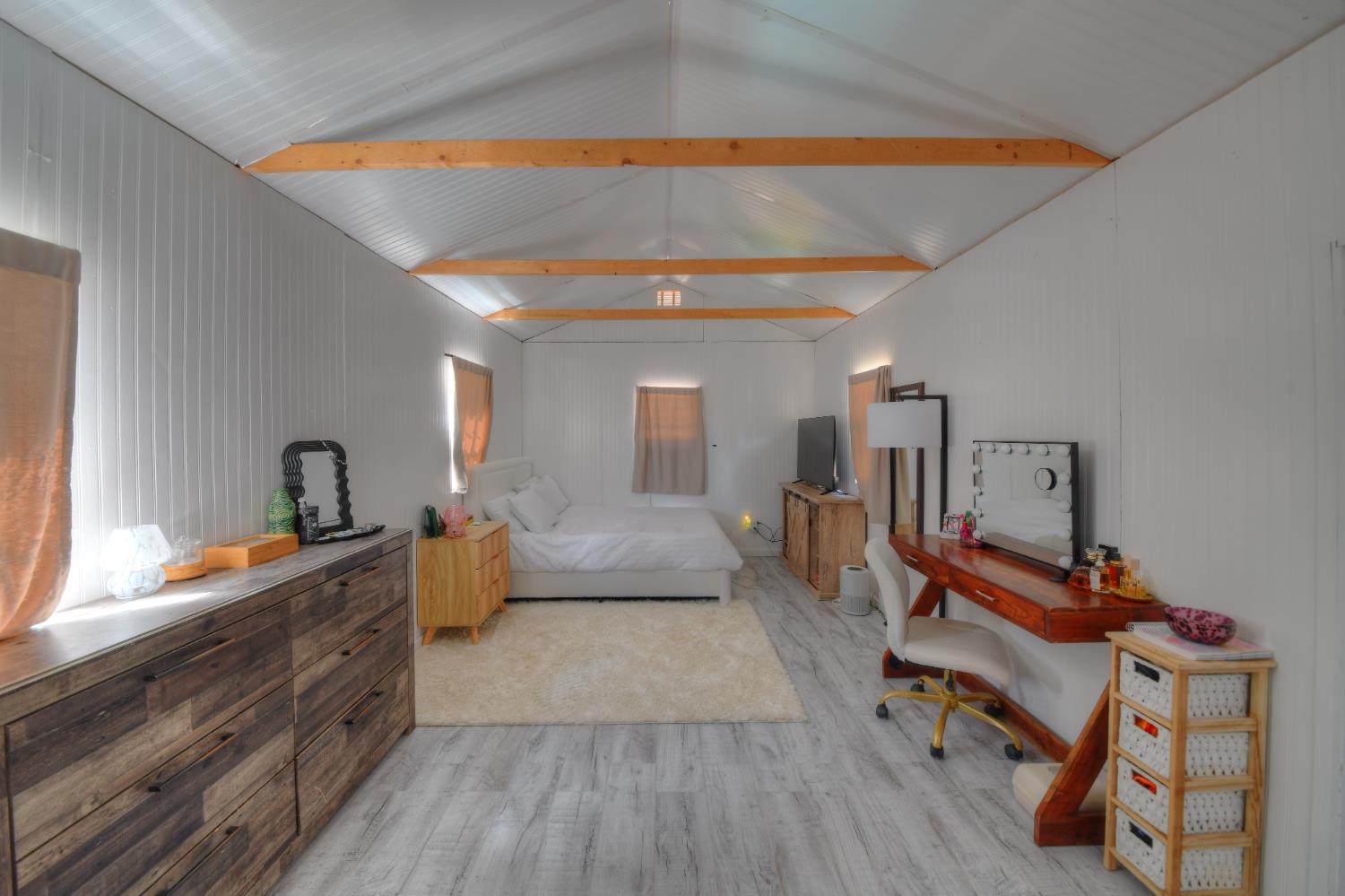 17045 Table Mountain Road Jamestown, CA 95327 - Photo 44 of 59 a bedroom with furniture and a wooden floor