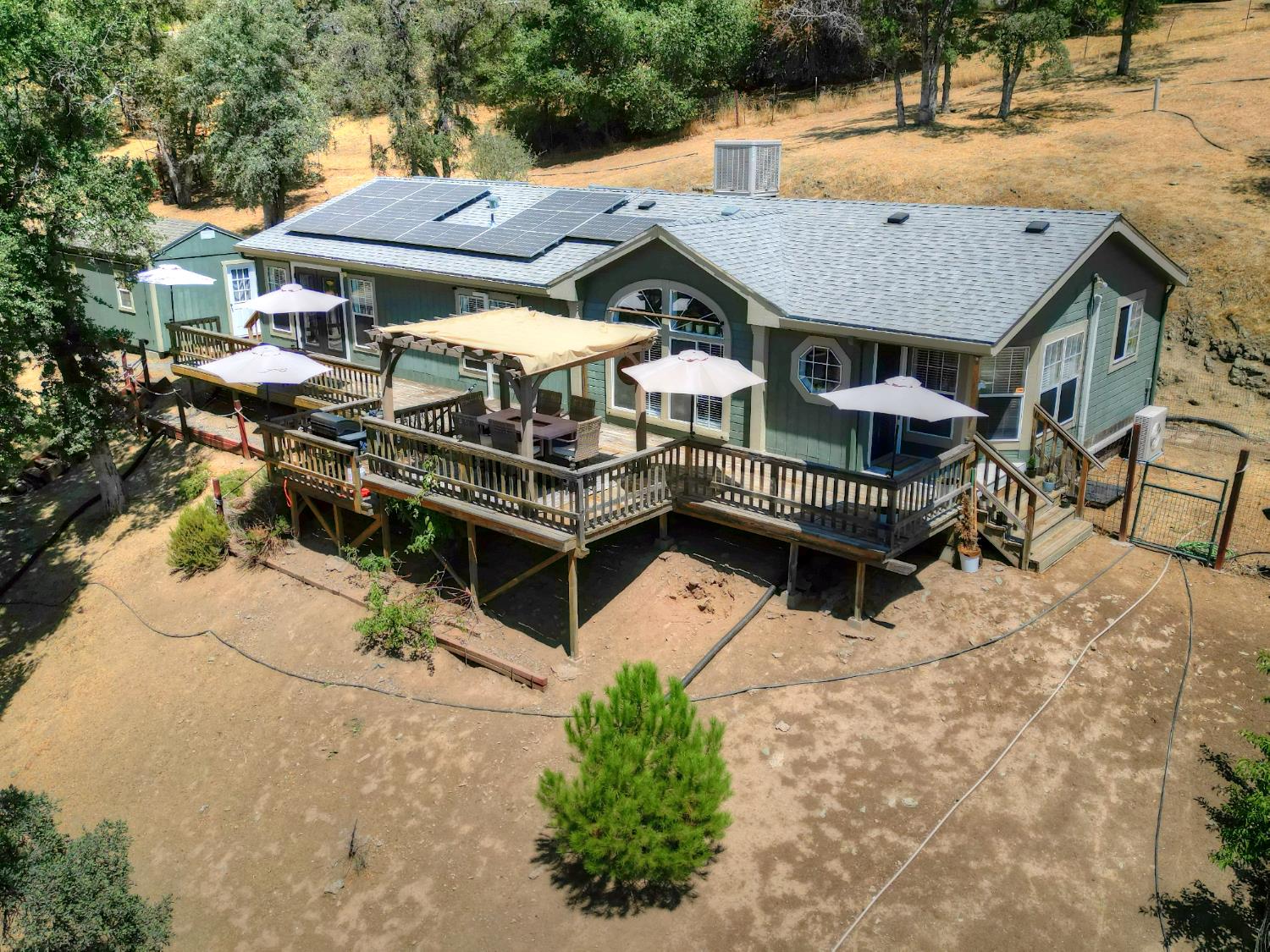 17045 Table Mountain Road Jamestown, CA 95327 - Photo 50 of 59 an aerial view of a house with swimming pool and porch