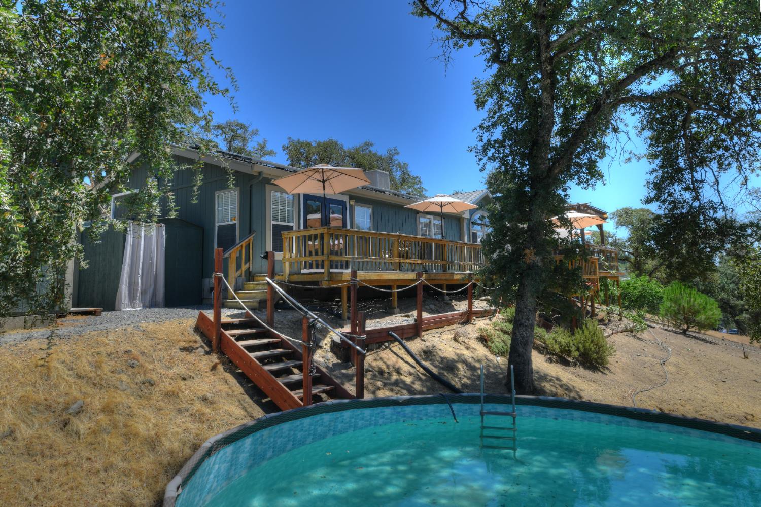 17045 Table Mountain Road Jamestown, CA 95327 - Photo 5 of 59 a view of a house with backyard