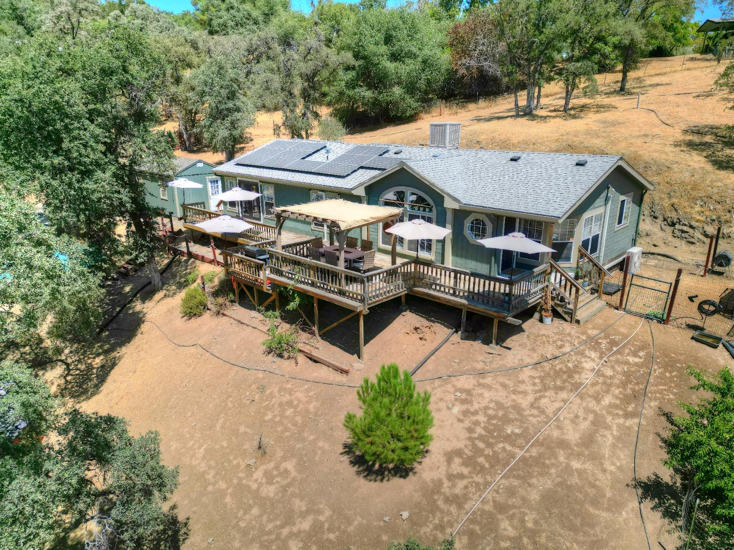 17045 Table Mountain Road Jamestown, CA 95327 - Photo 51 of 59 an aerial view of a house with swimming pool and sitting area
