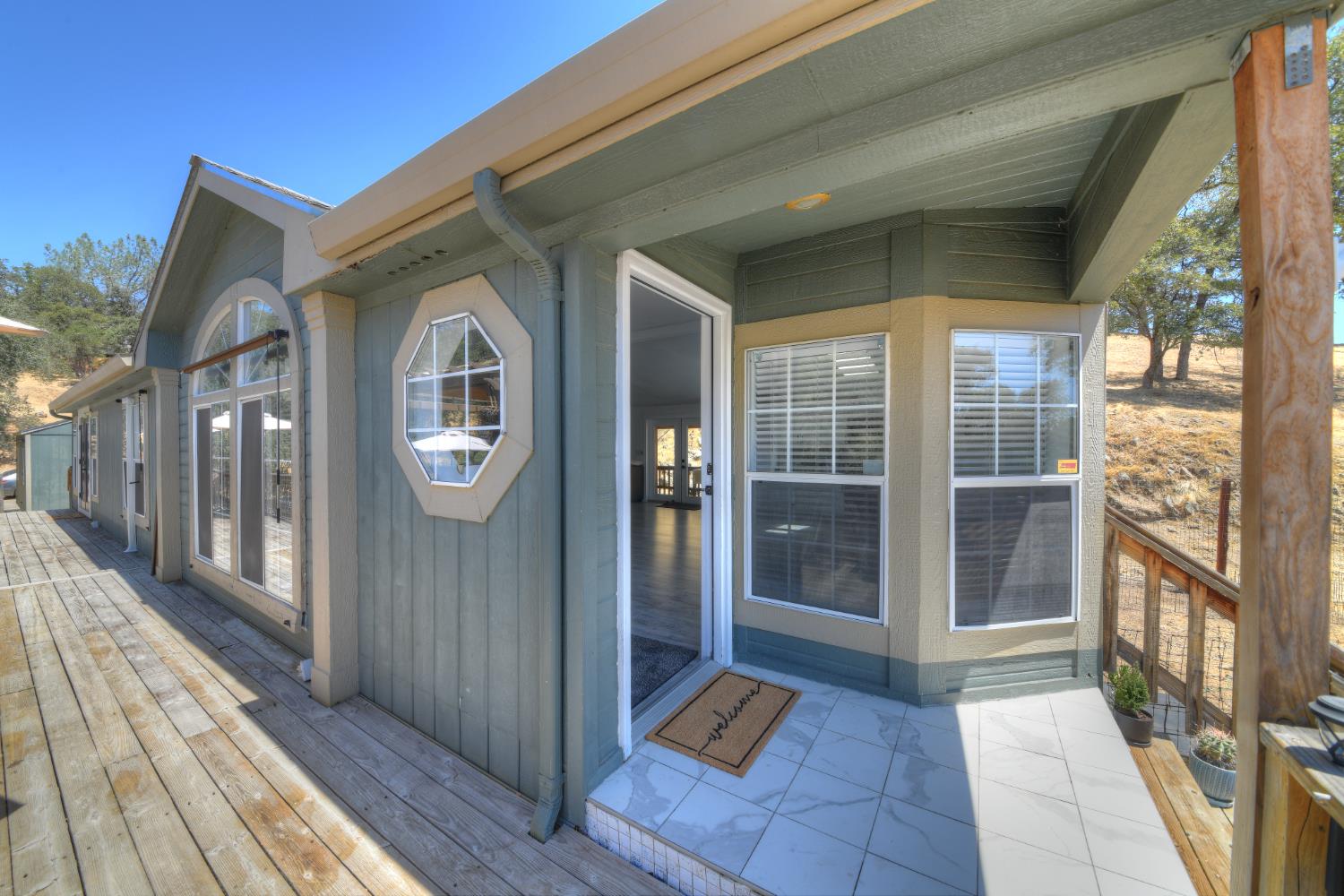 17045 Table Mountain Road Jamestown, CA 95327 - Photo 6 of 59 a view of a house with a glass door