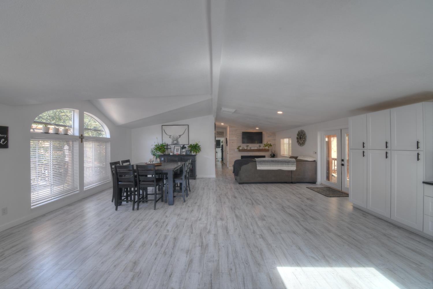 17045 Table Mountain Road Jamestown, CA 95327 - Photo 8 of 59 a view of a dining room with furniture and wooden floor
