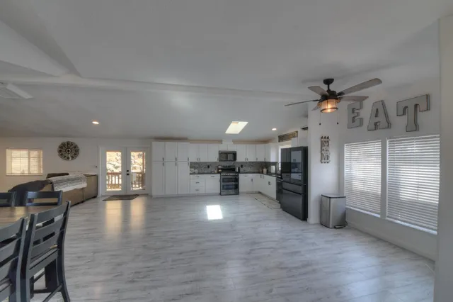 a large kitchen with a table and chairs in it