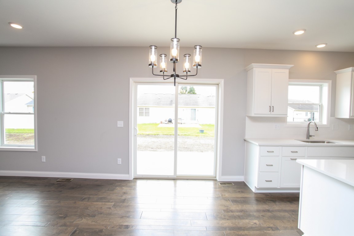 511 Bobwhite Way Normal, IL 61761 - Photo 13 of 39 a view of a kitchen with a sink and a window