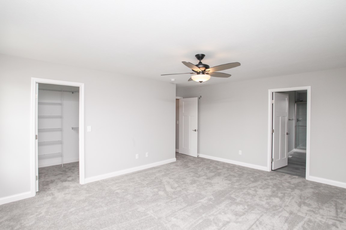 511 Bobwhite Way Normal, IL 61761 - Photo 24 of 39 a view of an empty room with a fan