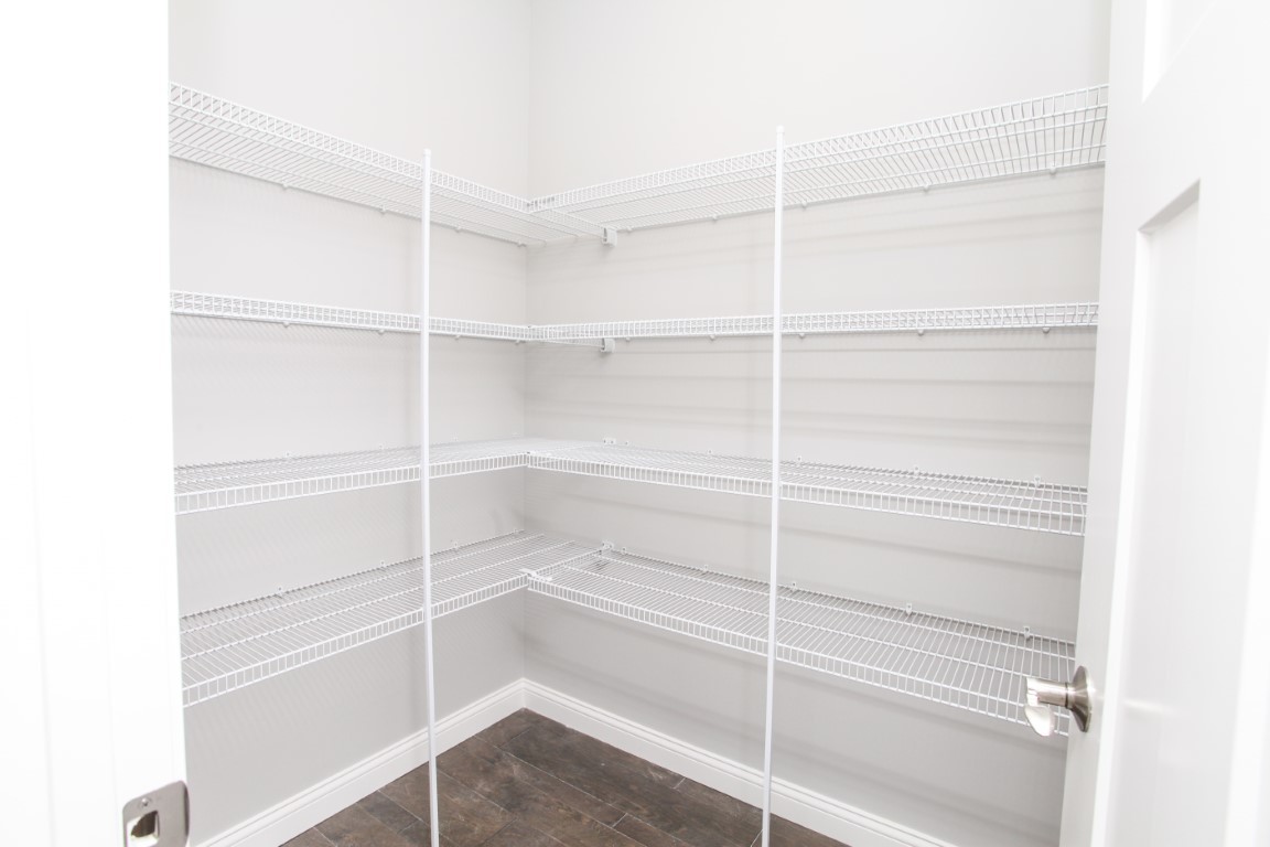 511 Bobwhite Way Normal, IL 61761 - Photo 27 of 39 a view of walk in closet with empty racks