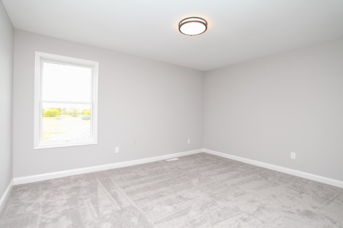 511 Bobwhite Way Normal, IL 61761 - Photo 32 of 39 an empty room with a window