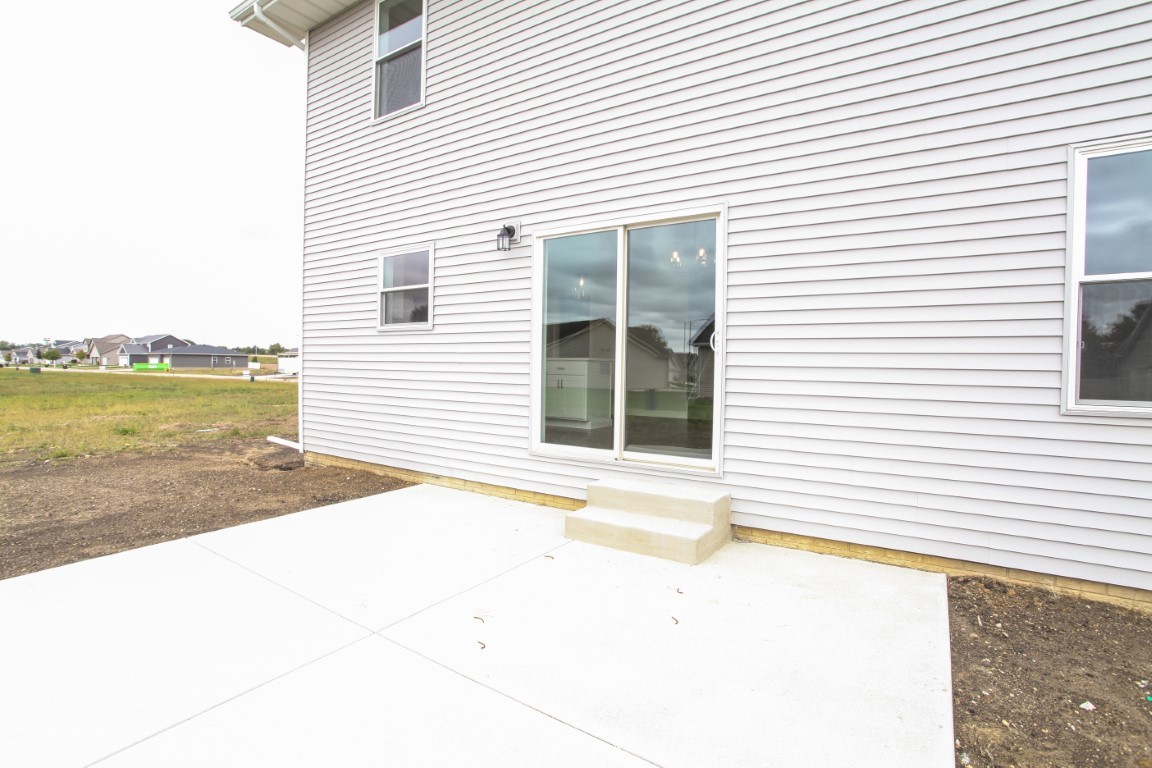511 Bobwhite Way Normal, IL 61761 - Photo 35 of 39 a view of a house with a yard and sitting area