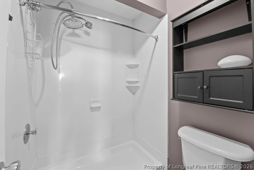 3446 Legion Road Hope Mills, NC 28348 - Photo 12 of 22 a bathroom with a toilet and a shower
