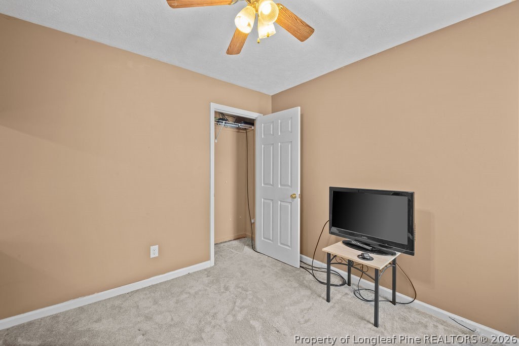 3446 Legion Road Hope Mills, NC 28348 - Photo 15 of 22 a view of a livingroom with a flat screen tv and a fan