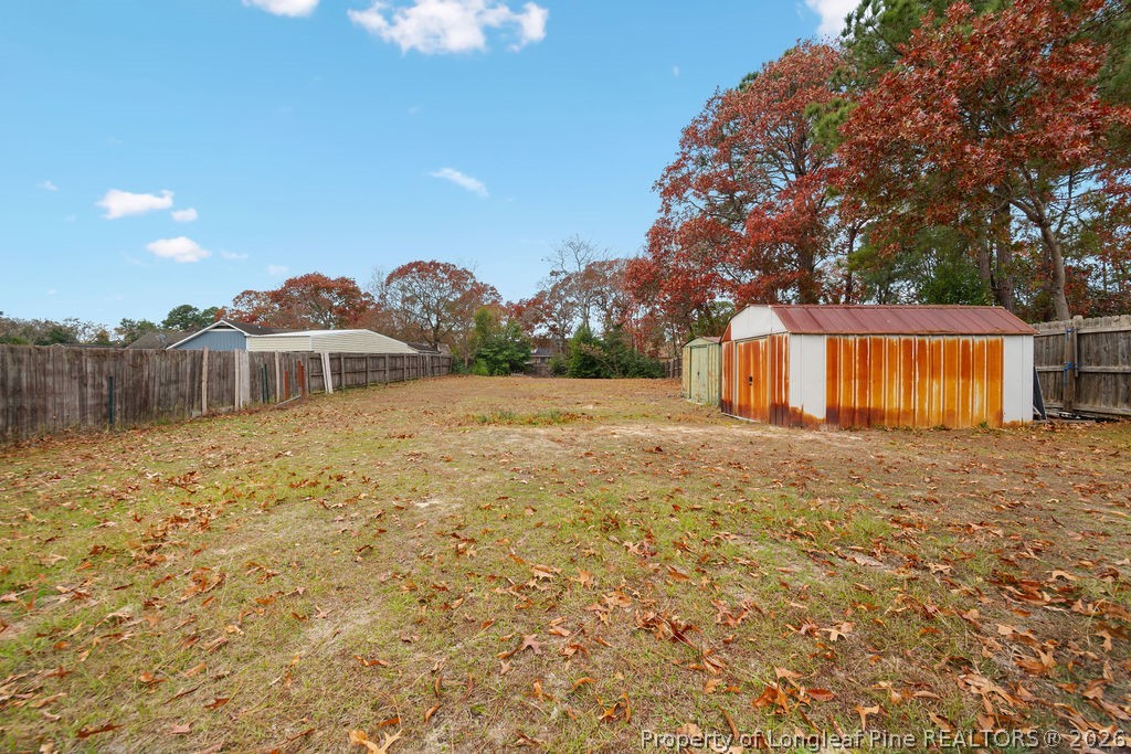 3446 Legion Road Hope Mills, NC 28348 - Photo 17 of 22 a front view of a house with garden