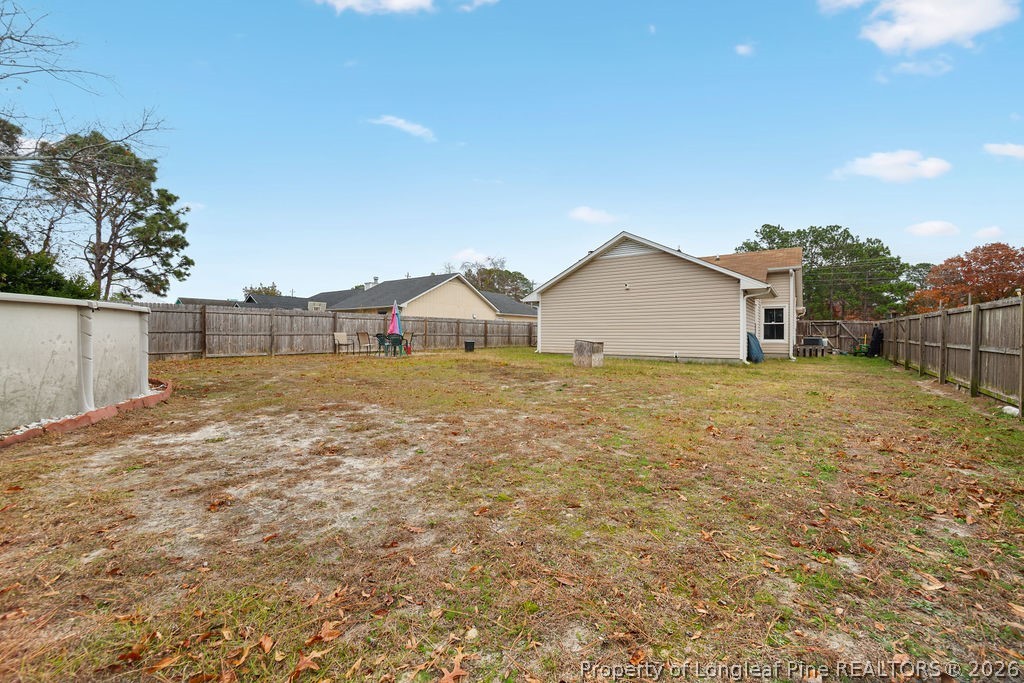 3446 Legion Road Hope Mills, NC 28348 - Photo 18 of 22 a view of a house with a yard