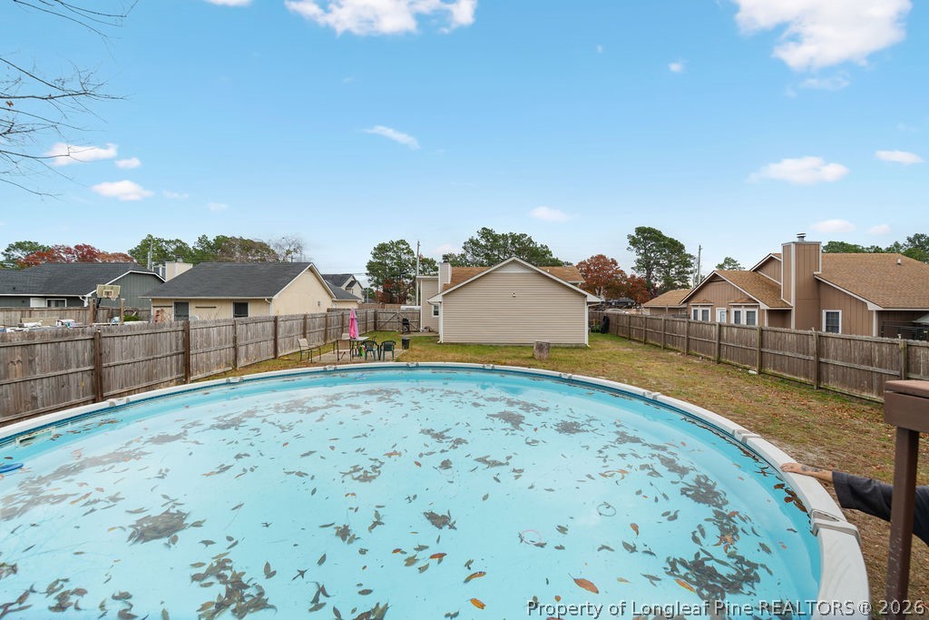 3446 Legion Road Hope Mills, NC 28348 - Photo 19 of 22 a front view of a house with a yard