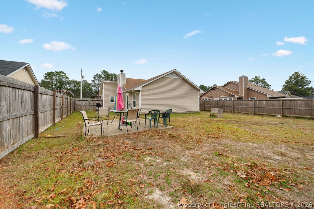 3446 Legion Road Hope Mills, NC 28348 - Photo 20 of 22 a view of a house with a yard and sitting area