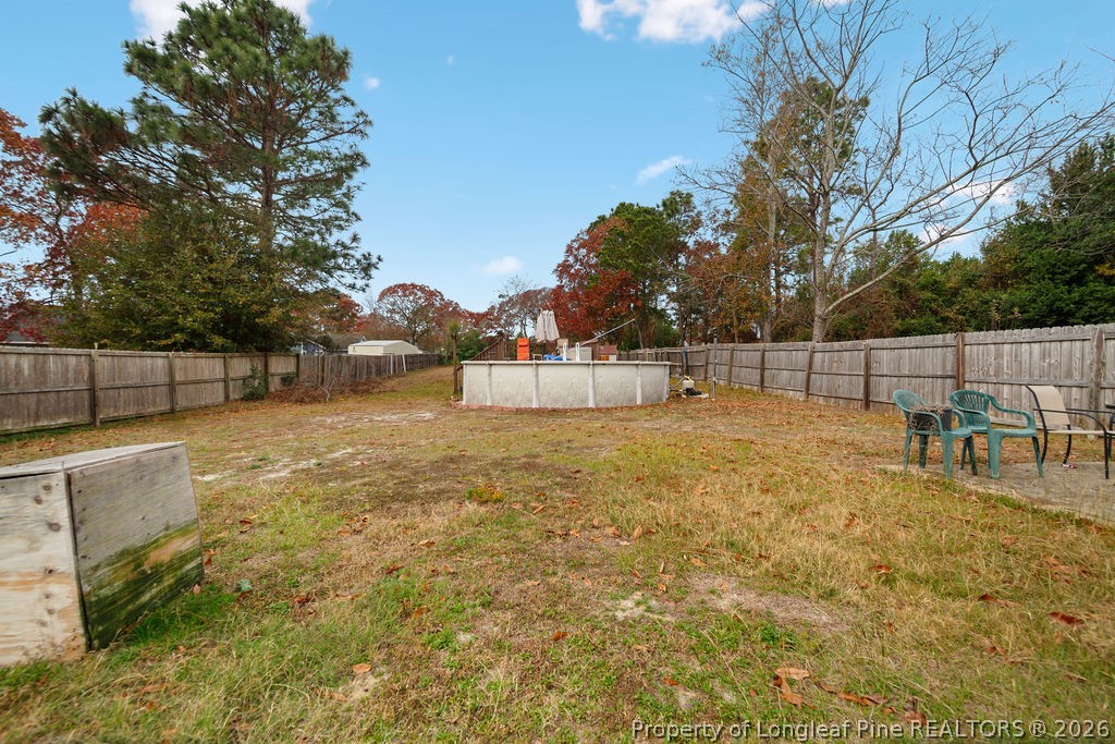3446 Legion Road Hope Mills, NC 28348 - Photo 22 of 22 a view of backyard with trampoline
