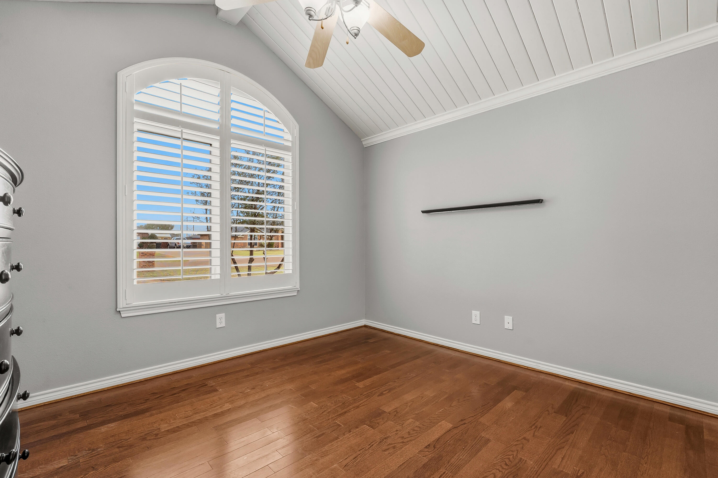 6903 87th Street Lubbock, TX 79424 - Photo 22 of 35 an empty room with wooden floor and windows