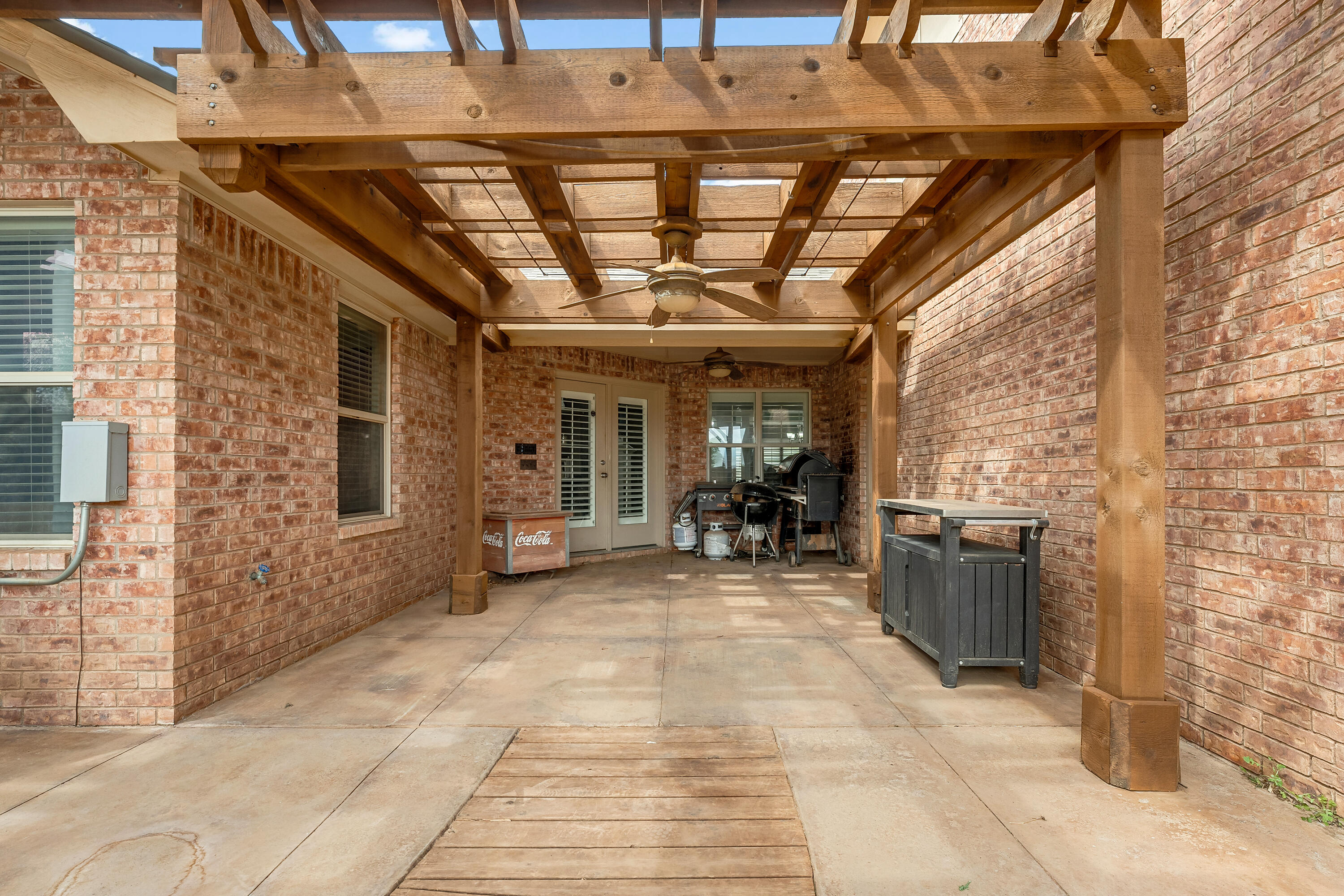 6903 87th Street Lubbock, TX 79424 - Photo 29 of 35 a view of a patio with table and chairs