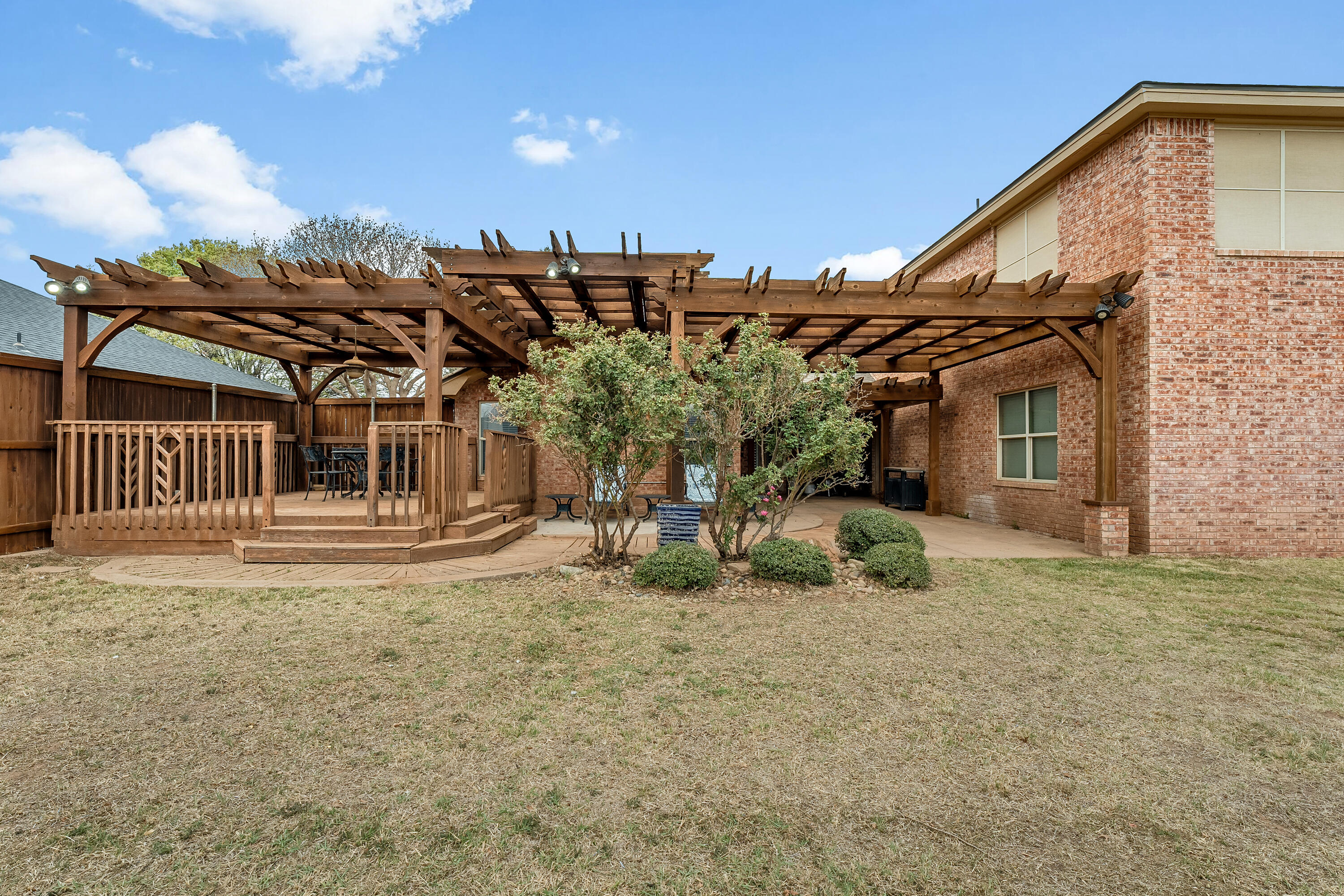 6903 87th Street Lubbock, TX 79424 - Photo 33 of 35 a view of a house with backyard and porch