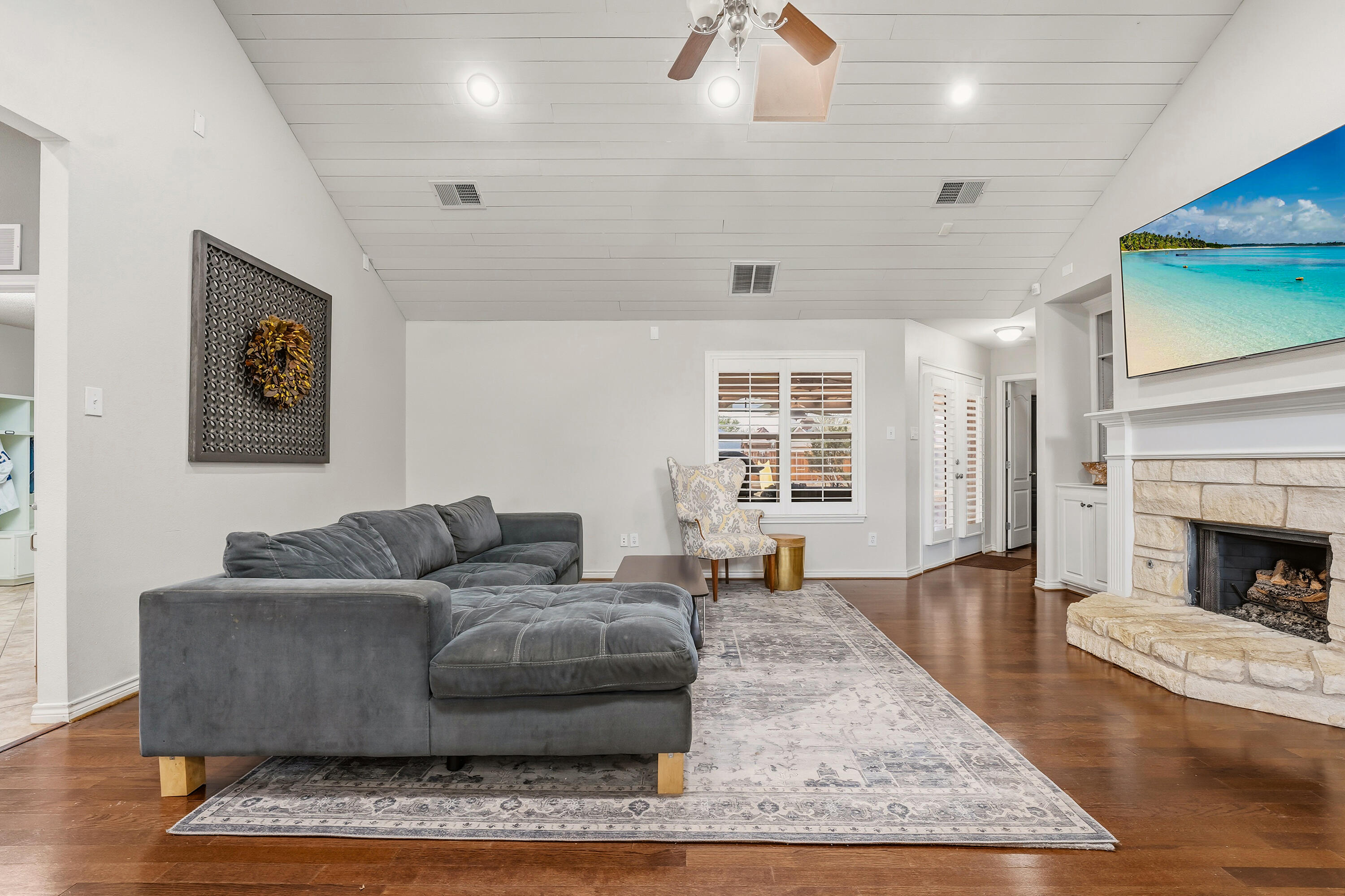 6903 87th Street Lubbock, TX 79424 - Photo 5 of 35 a living room with furniture and a fireplace