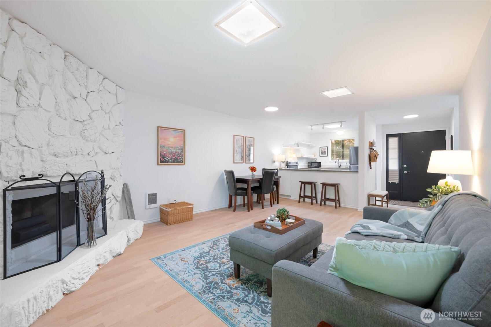 8017 196th Street Southwest, Unit 6B Edmonds, WA 98026 - Photo 7 of 23 a living room with furniture and kitchen view