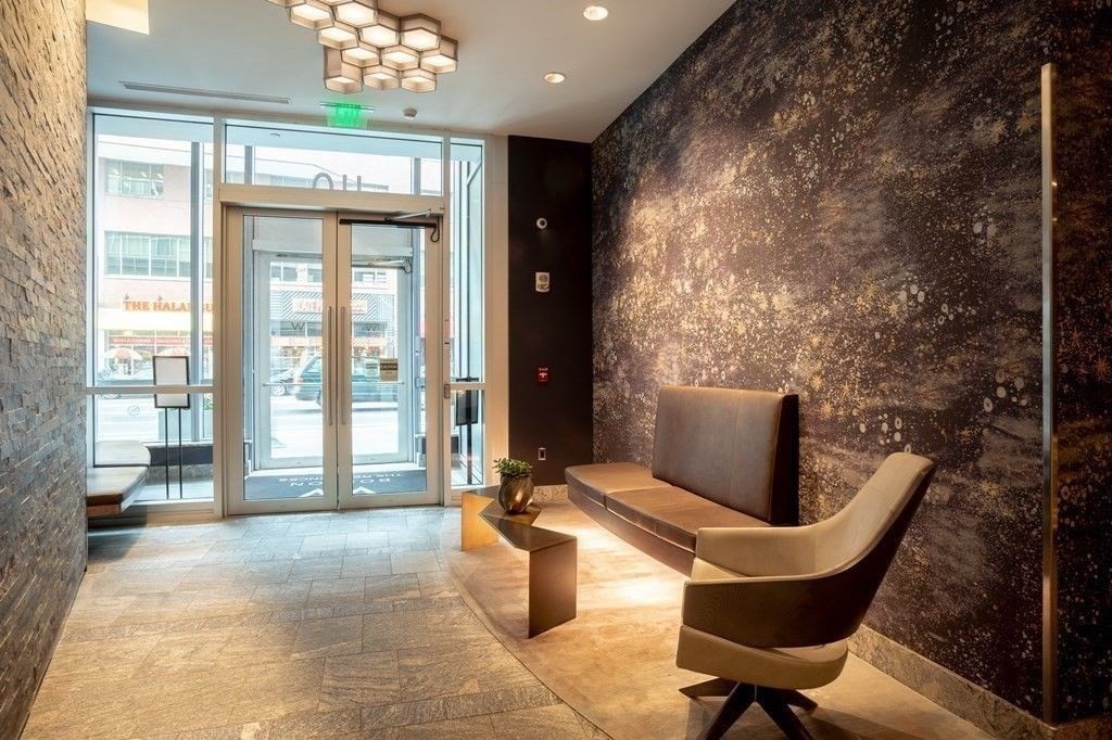 110 Stuart Street, Unit 19H Boston, MA 02116 - Photo 24 of 24 a lobby with furniture and floor to ceiling window