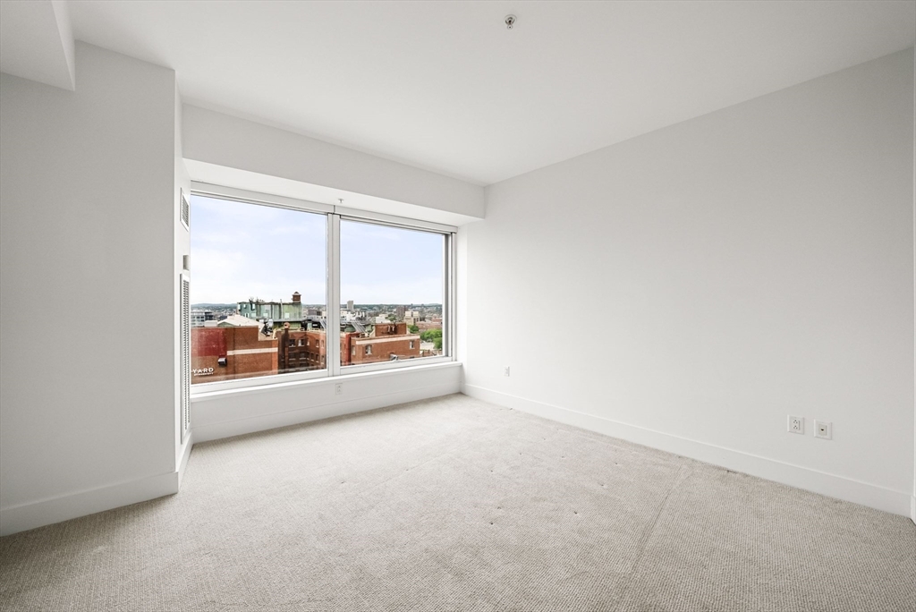 110 Stuart Street, Unit 19H Boston, MA 02116 - Photo 7 of 24 an empty room with a large window