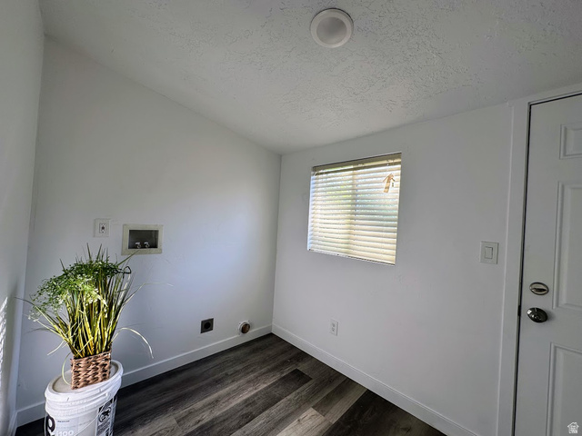629 North 100 East Logan, UT 84321 - Photo 10 of 11 Laundry area featuring wood-finish flooring, white walls, and a window with blinds