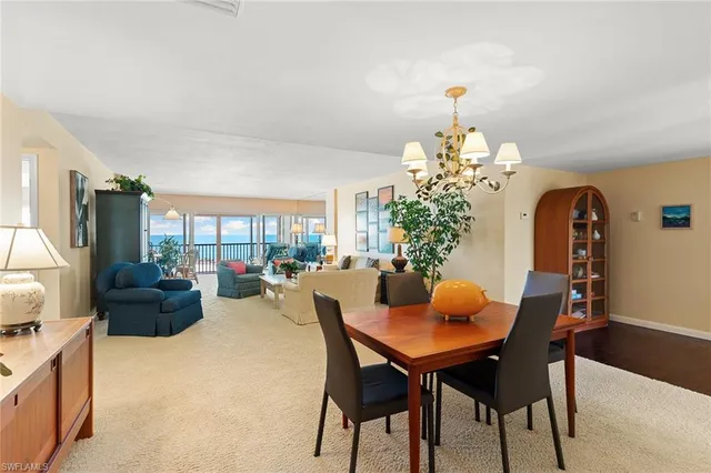 a dining room with furniture window and outside view