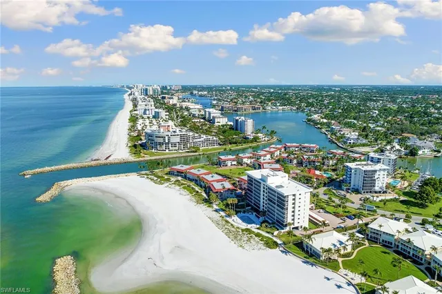 a view of swimming pool with outdoor seating and city view