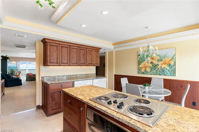 a kitchen with a stove and cabinets